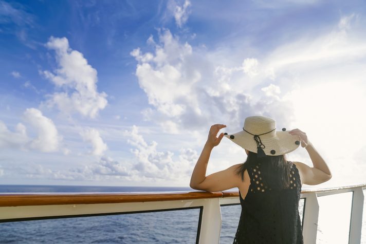 woman looking at the horizon on a cruise